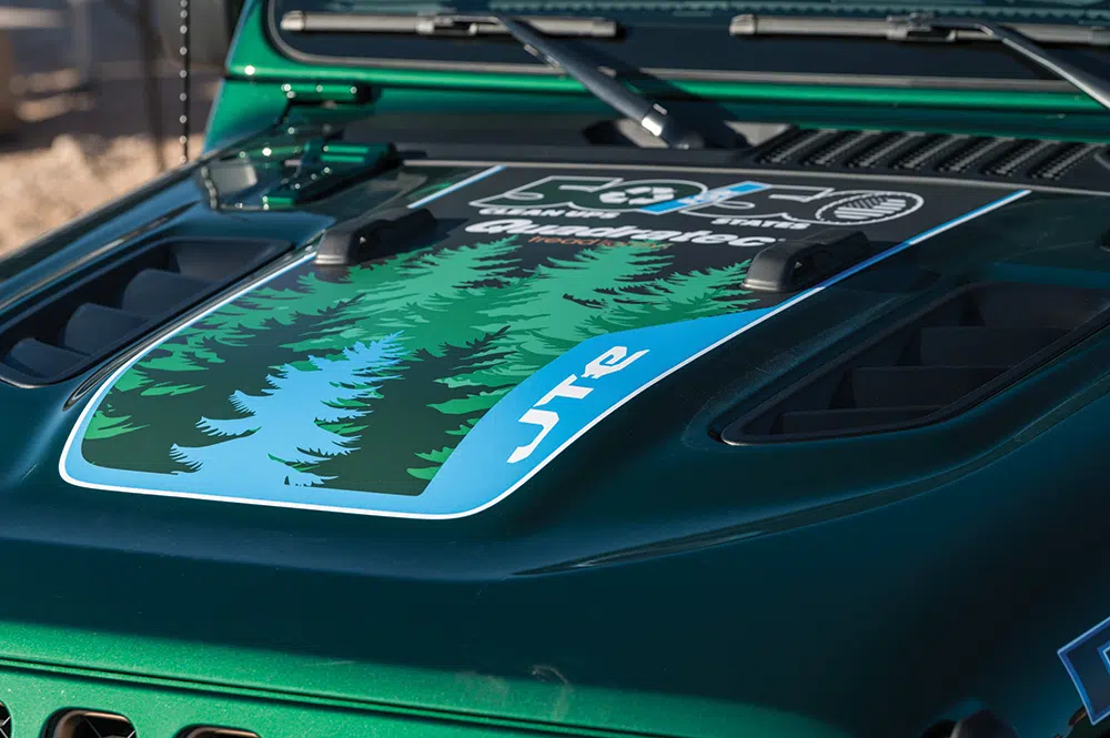 The hood of the JTe features light blue and dark green 50 for 50 badging.