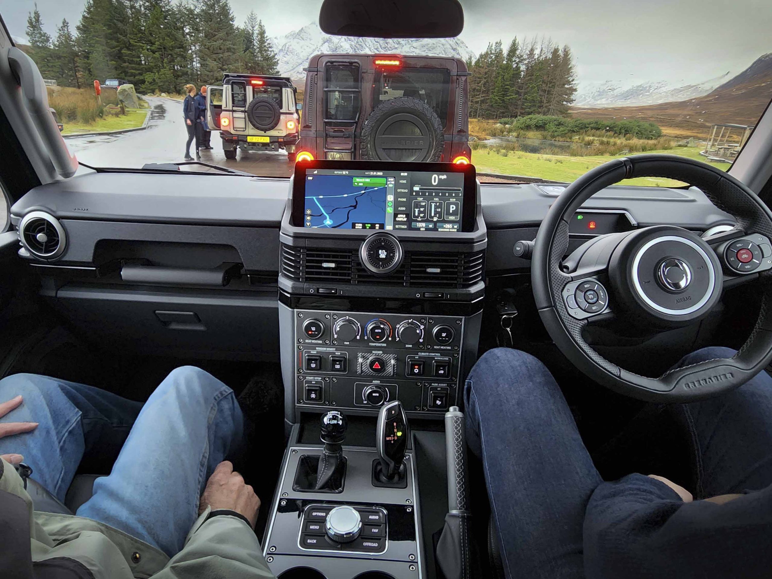 Inside view of a right-hand drive SUV with black interior.