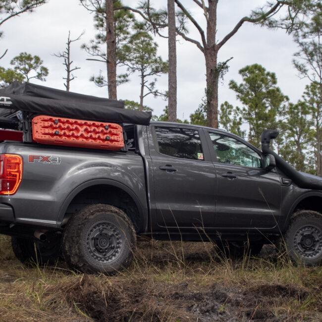 Ford Ranger with Black Rhino wheels and bed storage with Maxtrax mounted to the side.