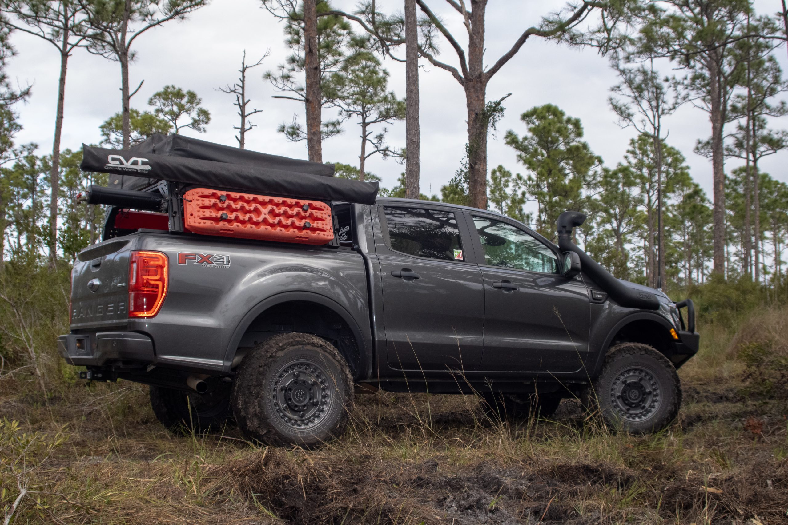 Ford Ranger with Black Rhino wheels and bed storage with Maxtrax mounted to the side.