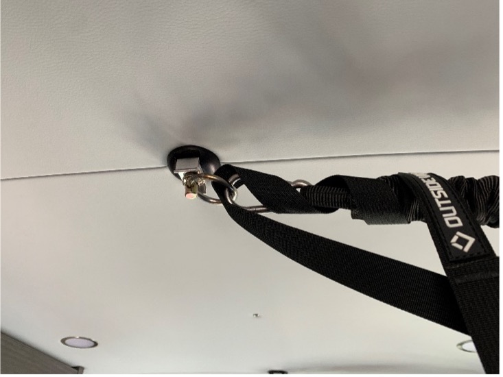 Custom fitment for strap on ceiling of van