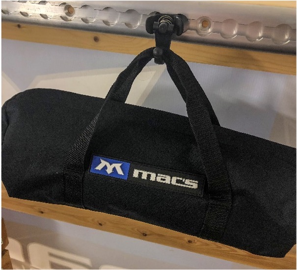 Macs Tie Downs threaded stud holds black bag.