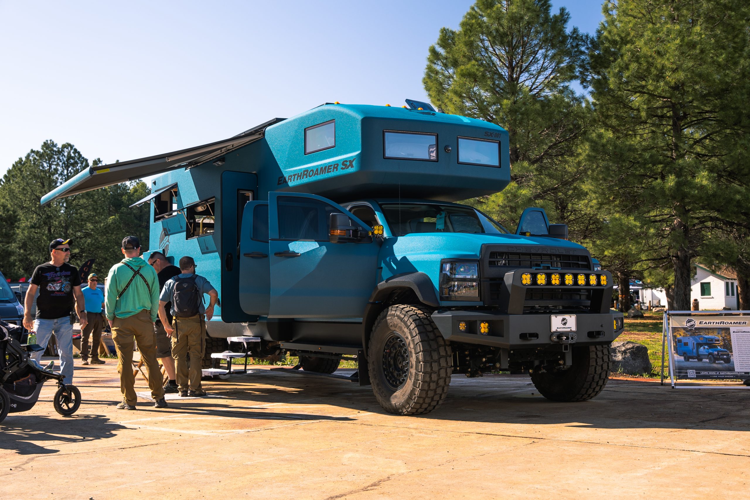 Gigantic blue/green EarthRoamer truck/camper combination at Overland Expo West.