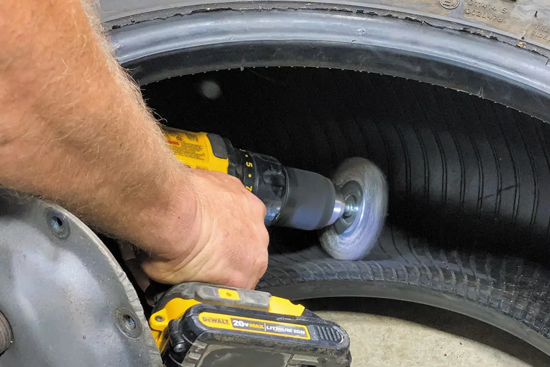 Use a buffing tool, wire brush, or heavy-grit sandpaper to remove the membrane liner
