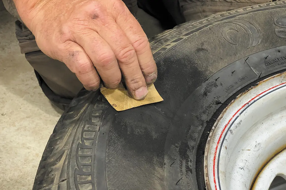 Identify the slice or damaged area, clean the surface, and let it dry