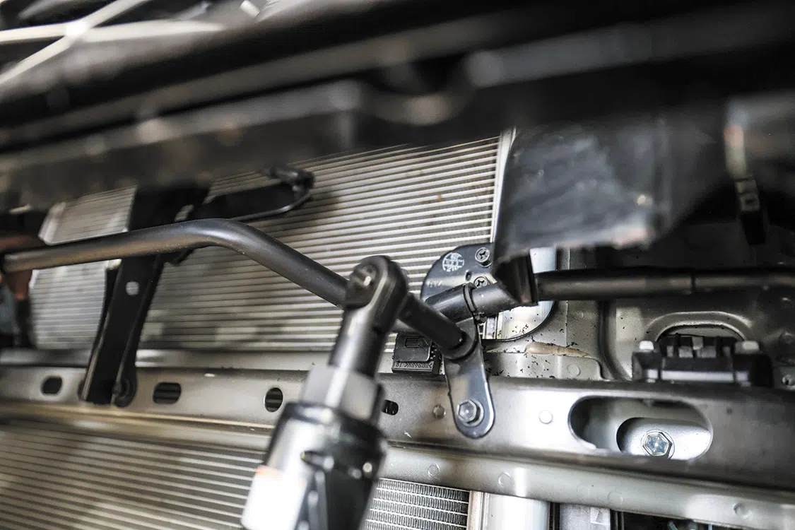 The bolts for the front AC line needed to be removed