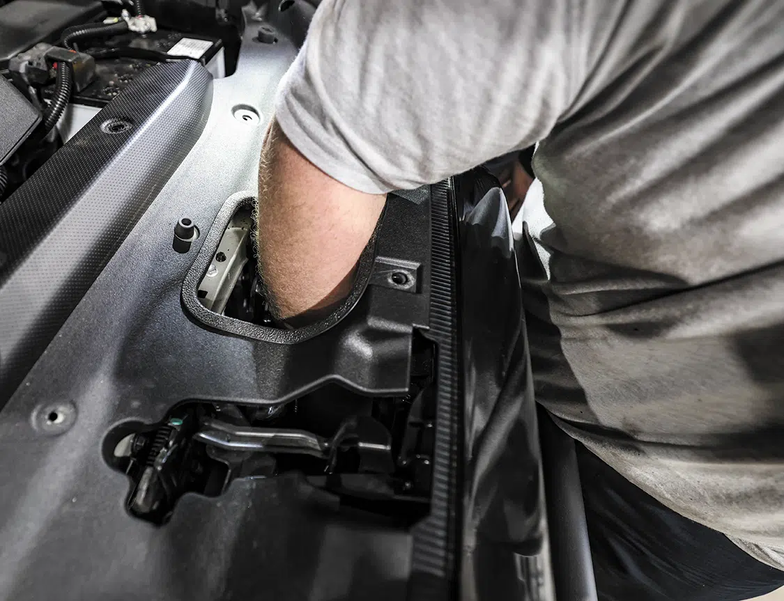 The top cover was reinstalled under the hood