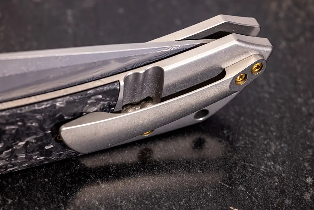 Kansept Fenrir Flipper Knife with a beadblasted titanium and shred carbon fiber handle